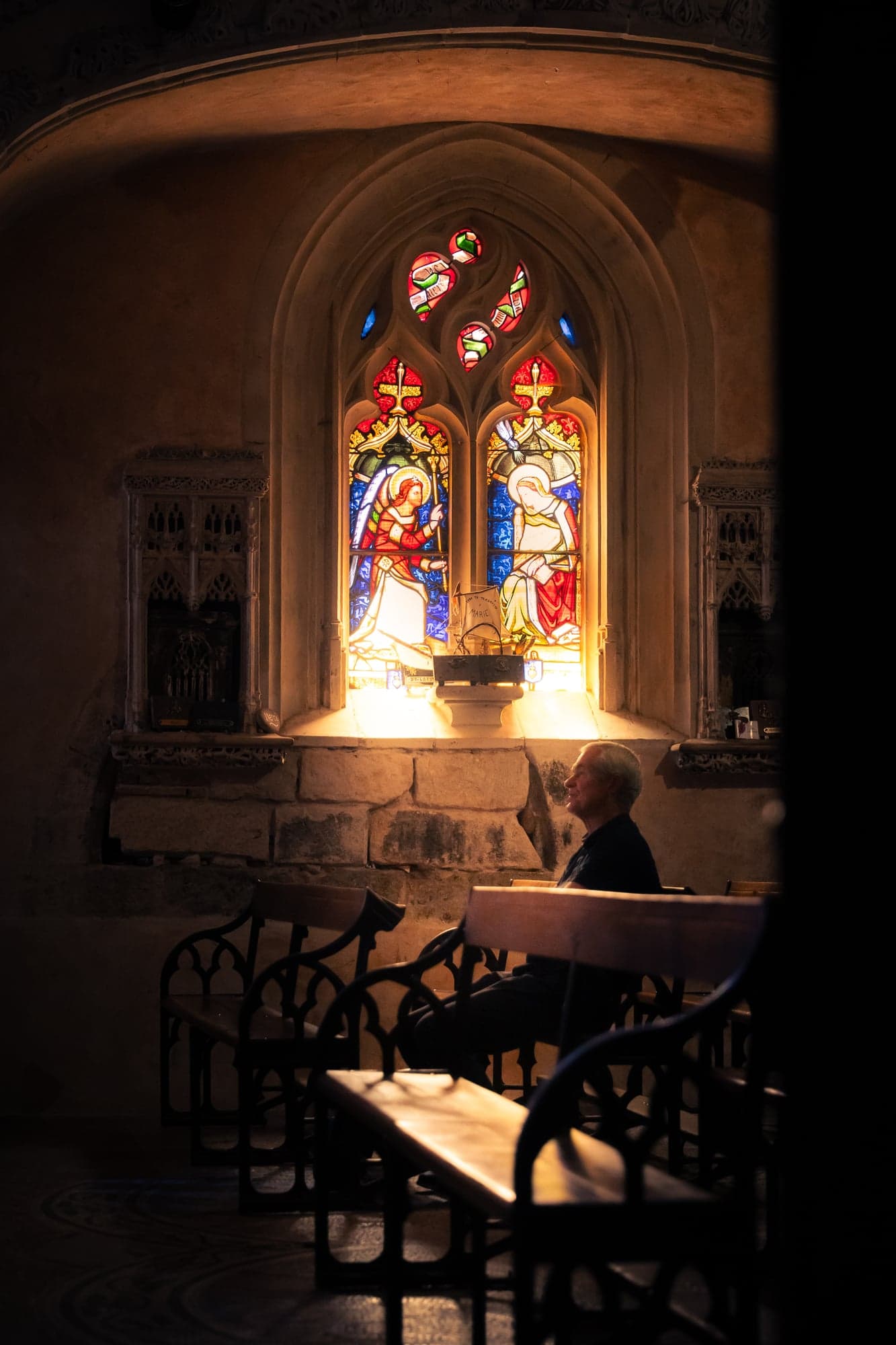 Stained glass and golden light inside a church